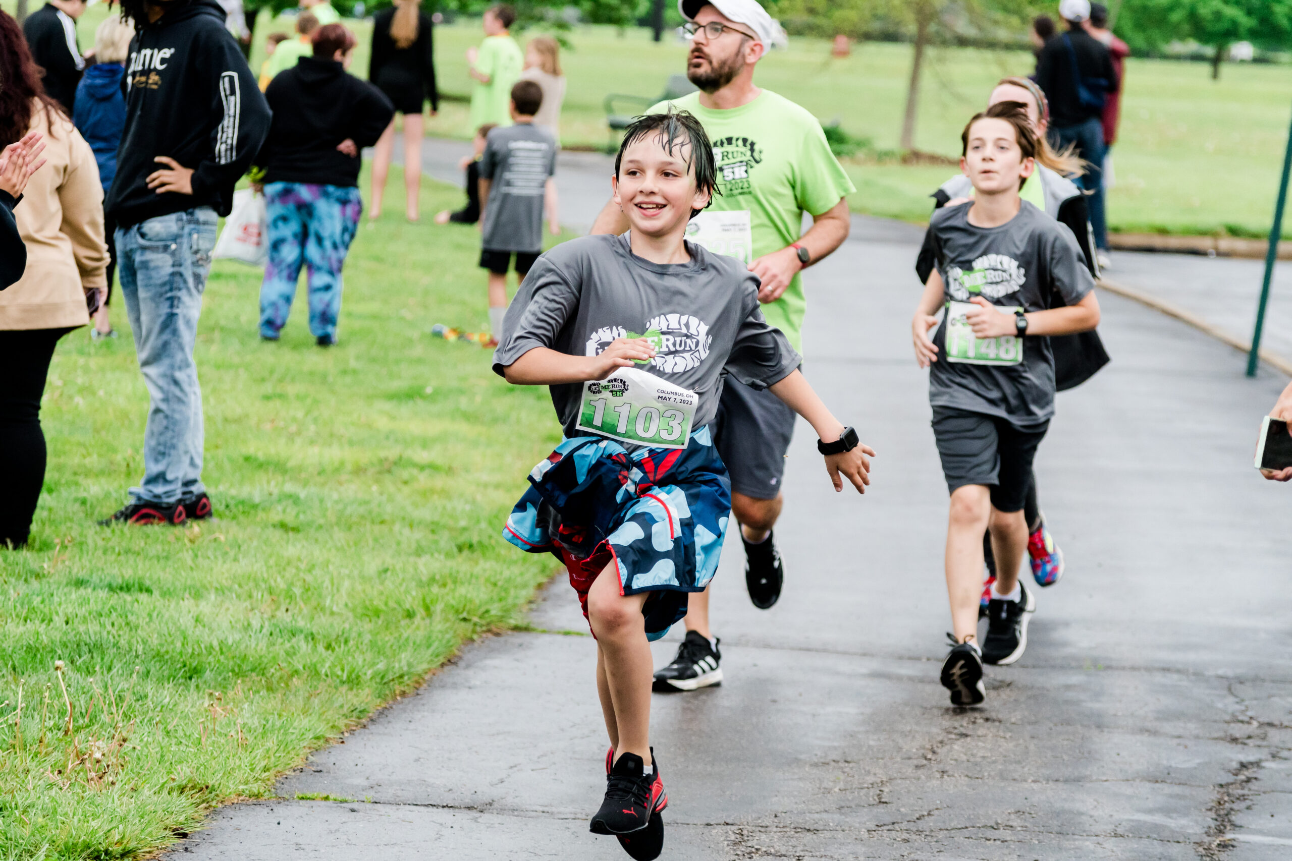 boy high fiving bystander during let me run 5k